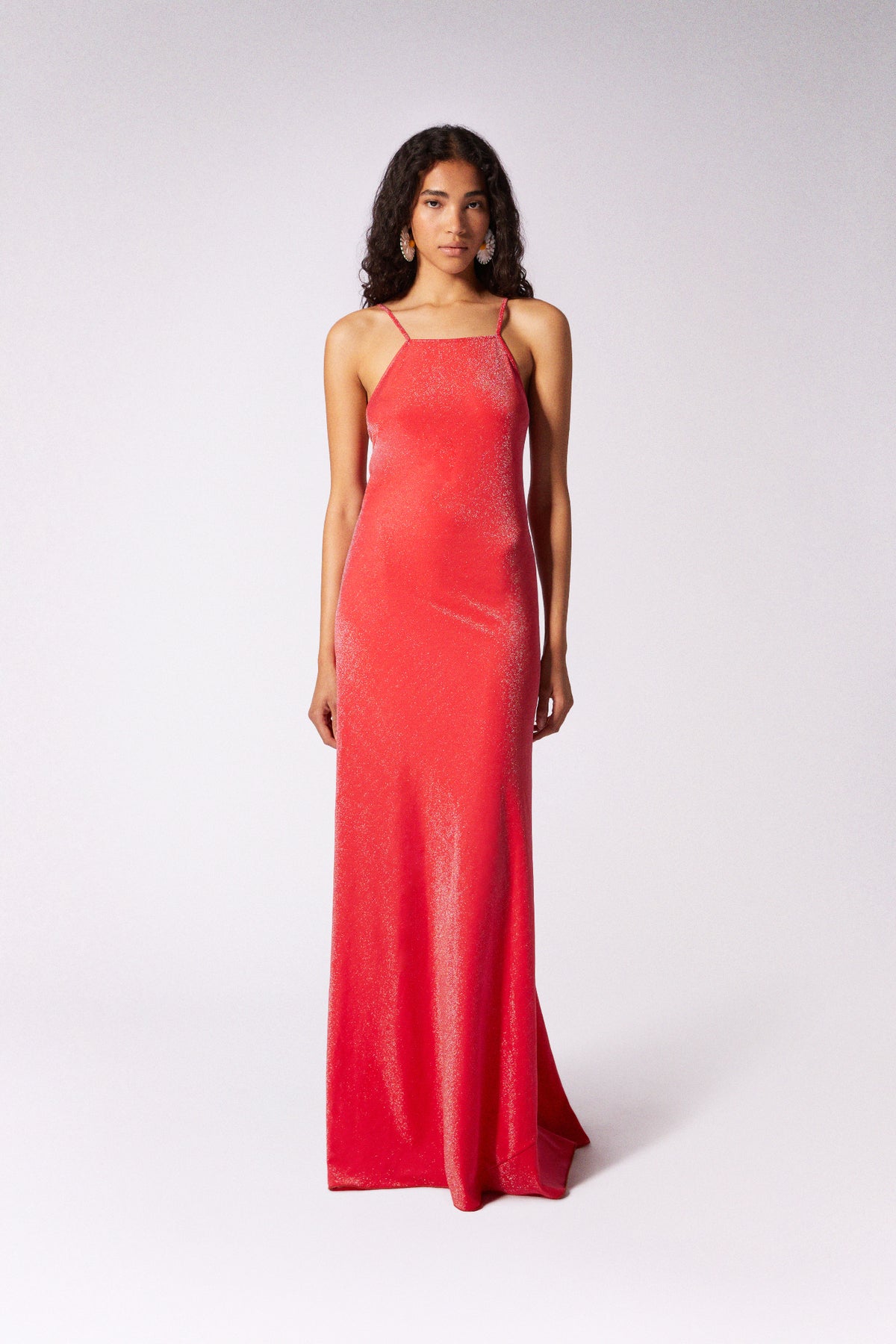 Red Luna maxi dress by Maccapani, flowing fabric, sleeveless design, and elegant silhouette perfect for summer wear.