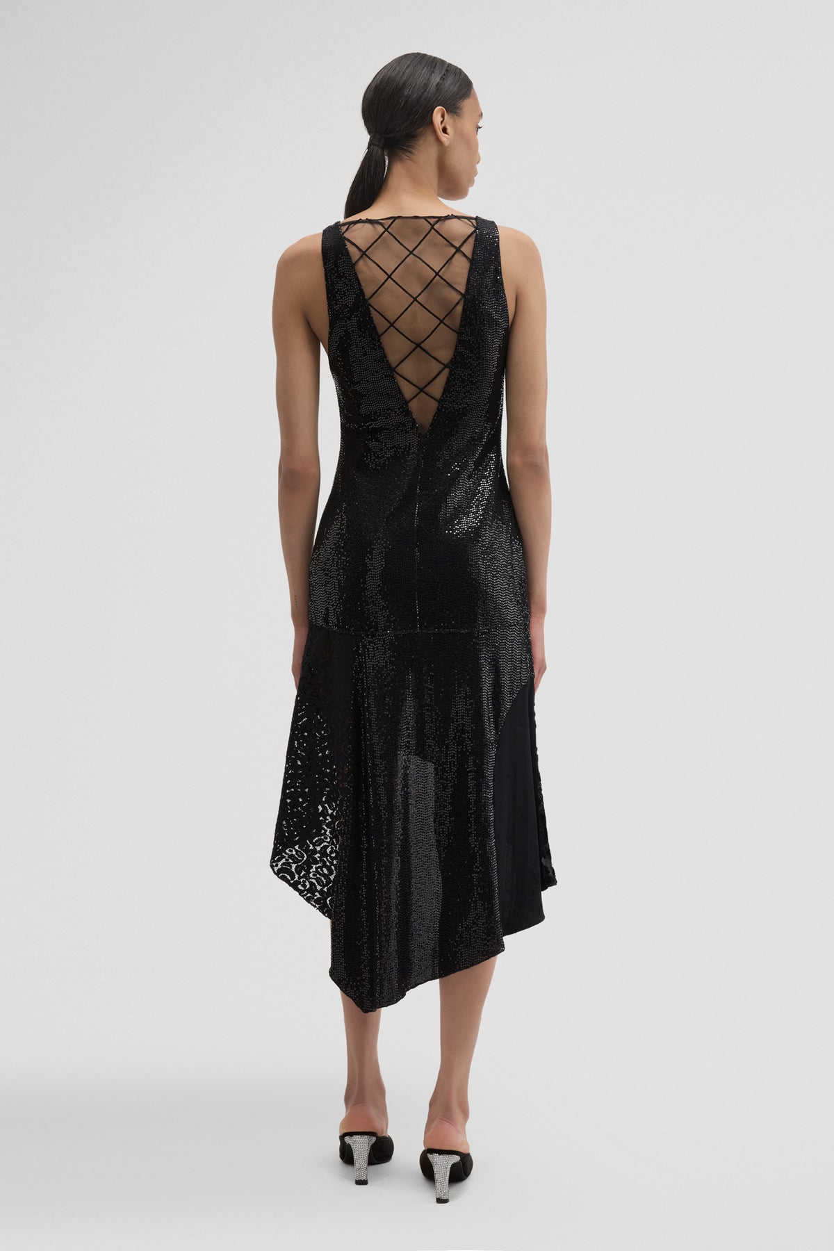 Black midi dress by Maccapani featuring a sleek, fitted design with elegant detailing, perfect for stylish occasions.