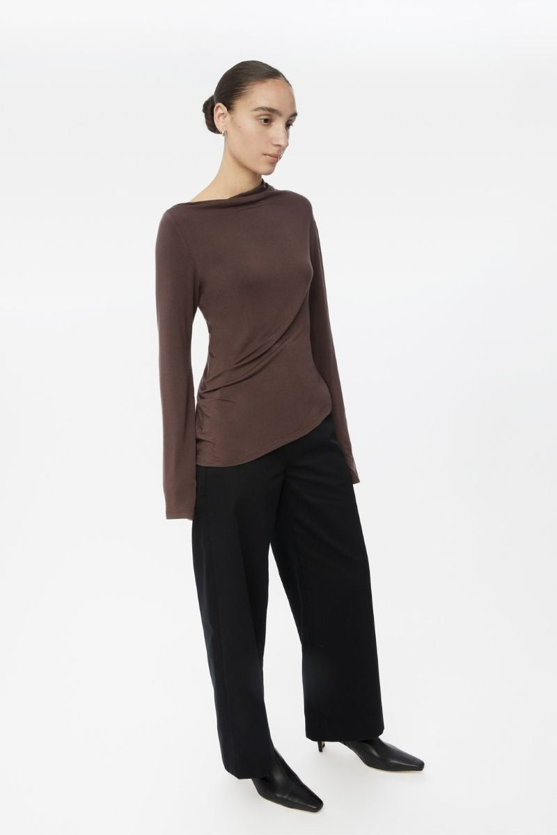 Dāl the Label modal asymmetric knit top featuring a stylish, flowing design with a loose fit and ribbed neckline.