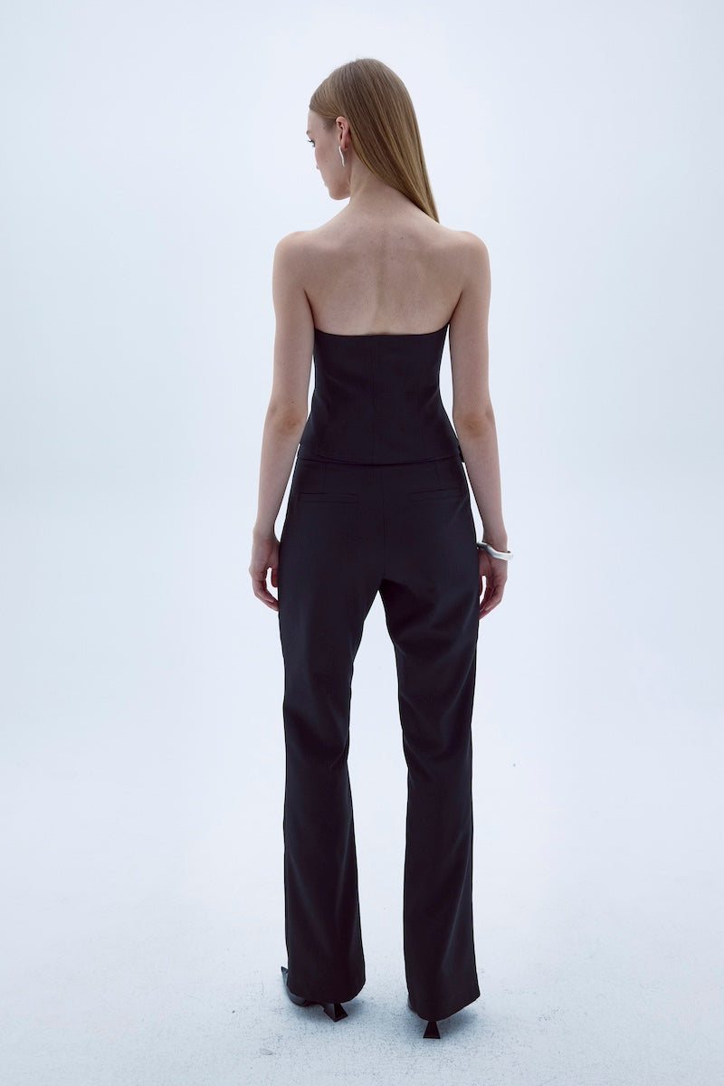 Black Nazlı Ceren ODYLE top featuring a stylish design, displayed on a mannequin with a close-up view of the fabric and neckline.