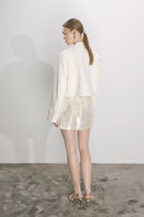 Nazlı Ceren vanilla ice satin cropped jacket with long sleeves and a sleek, stylish design, perfect for modern fashion.