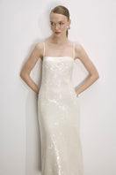 Nazlı Ceren Miles Sequin Dress in Cloud Cream, a midi dress with shimmering sequins and elegant design, displayed on a model.