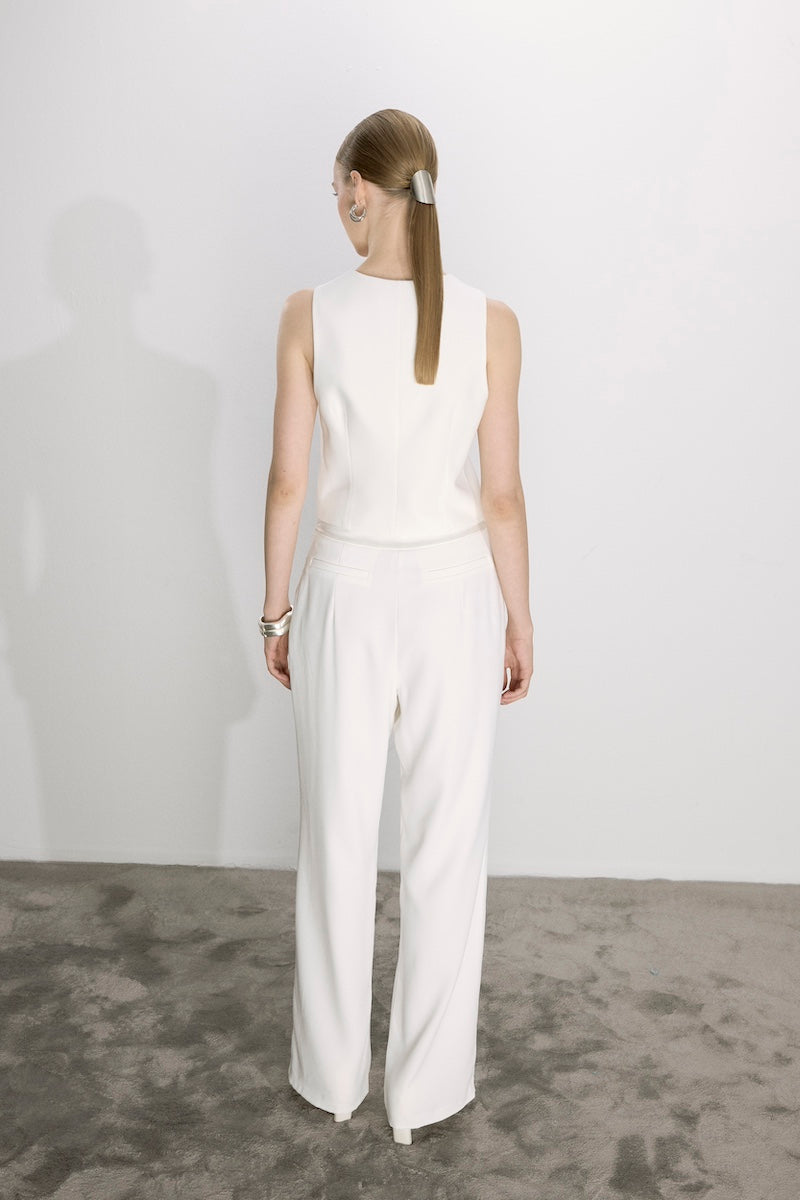 White Marielle vest by Nazlı Ceren, a stylish sleeveless top with a fitted silhouette and elegant design.
