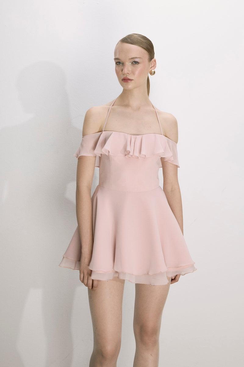 Nazlı Ceren Evie mini dress in tender peach, sleeveless with a fitted waist and flowy skirt, perfect for summer occasions.