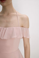 Nazlı Ceren Evie Mini Dress in Tender Peach, stylish sleeveless dress with a flowy silhouette and delicate fabric detail.
