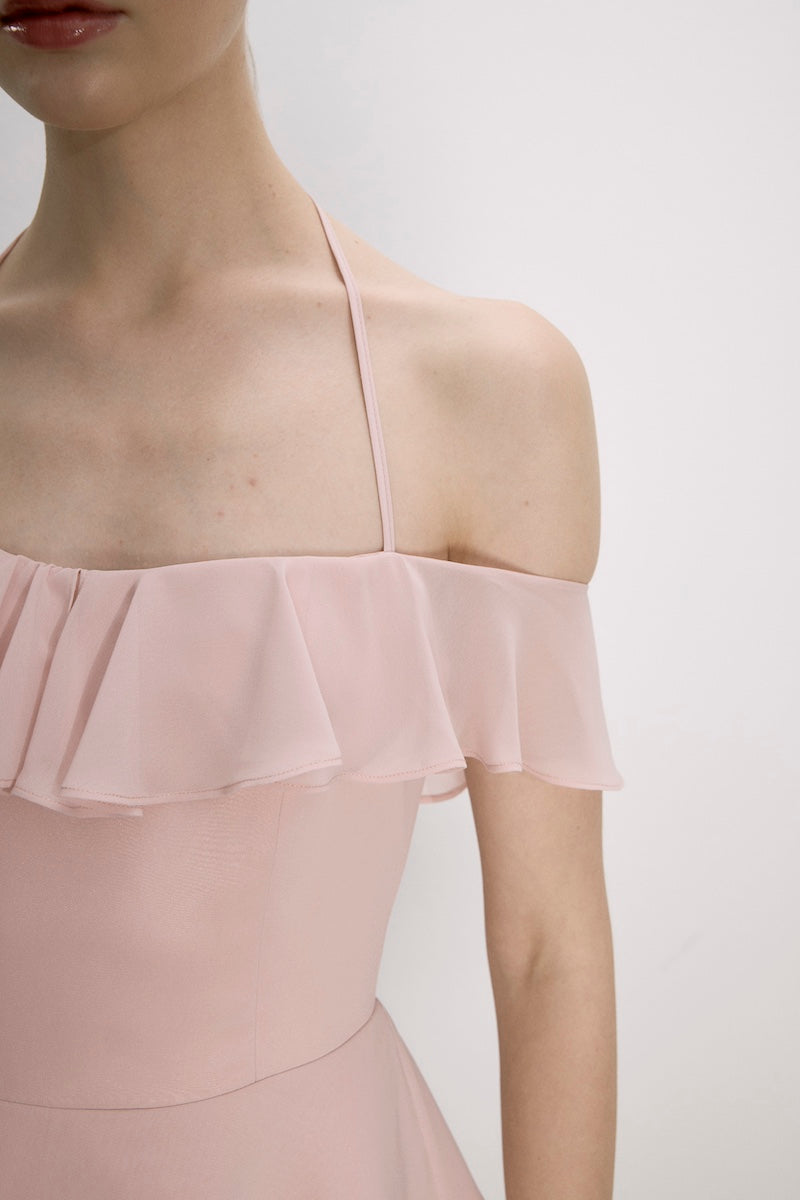 Nazlı Ceren Evie Mini Dress in Tender Peach, stylish sleeveless dress with a flowy silhouette and delicate fabric detail.