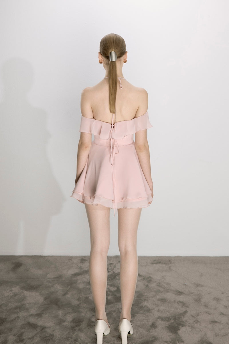 Nazlı Ceren Evie mini dress in tender peach, lightweight sleeveless mini dress with a fitted bodice and flared skirt.