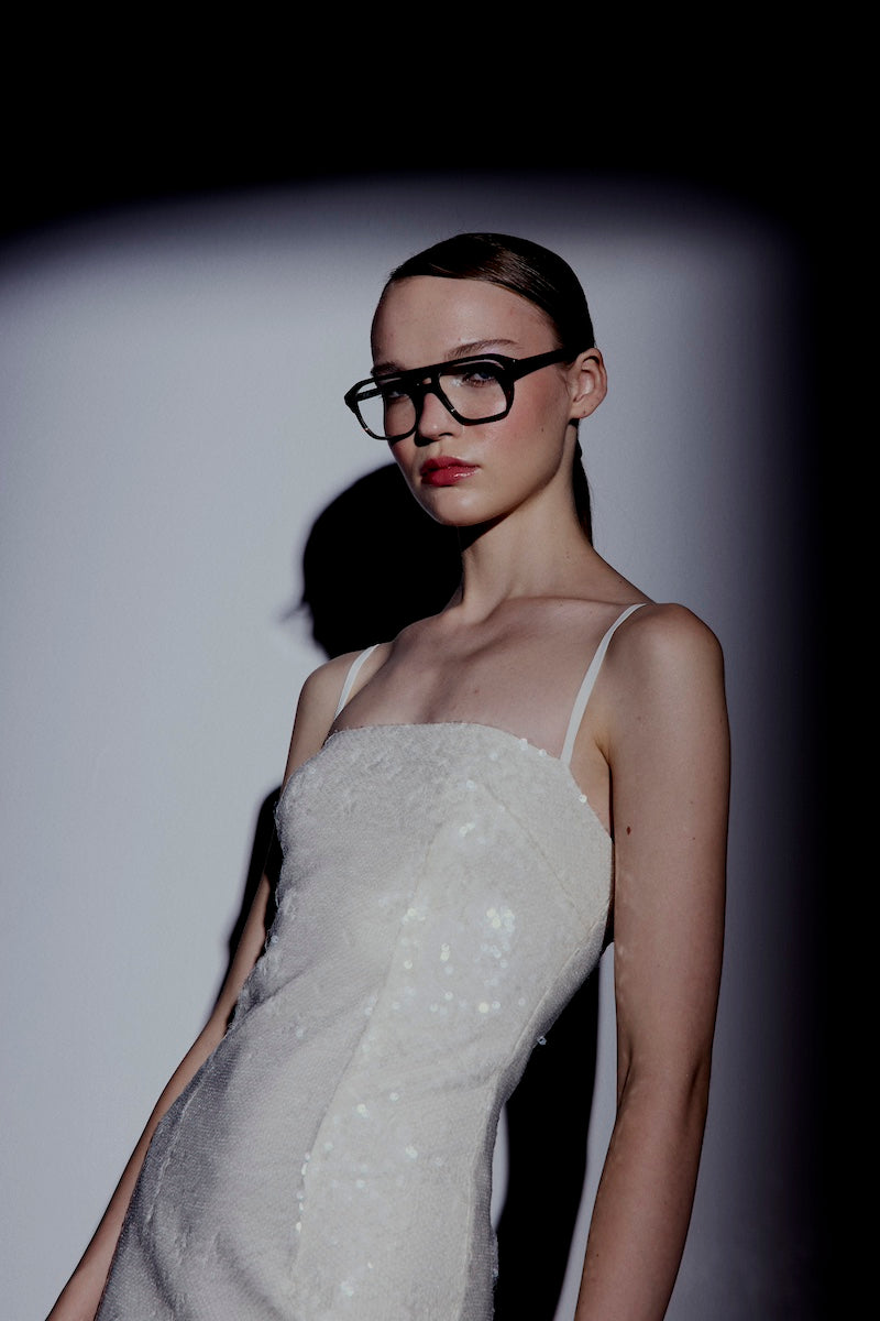 Nazlı Ceren Miles Sequin Dress in Cloud Cream, a midi dress with shimmering sequins and elegant fit, displayed on a model.