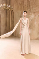 Arti Apparel ARISA Maxi Dress in flowing fabric with a fitted waist and elegant design, displayed on a hanger.