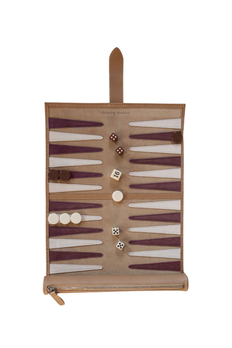 Travel backgammon board in Bordeaux style by Throwing Doubles, featuring a compact game set with colorful pieces and dice.