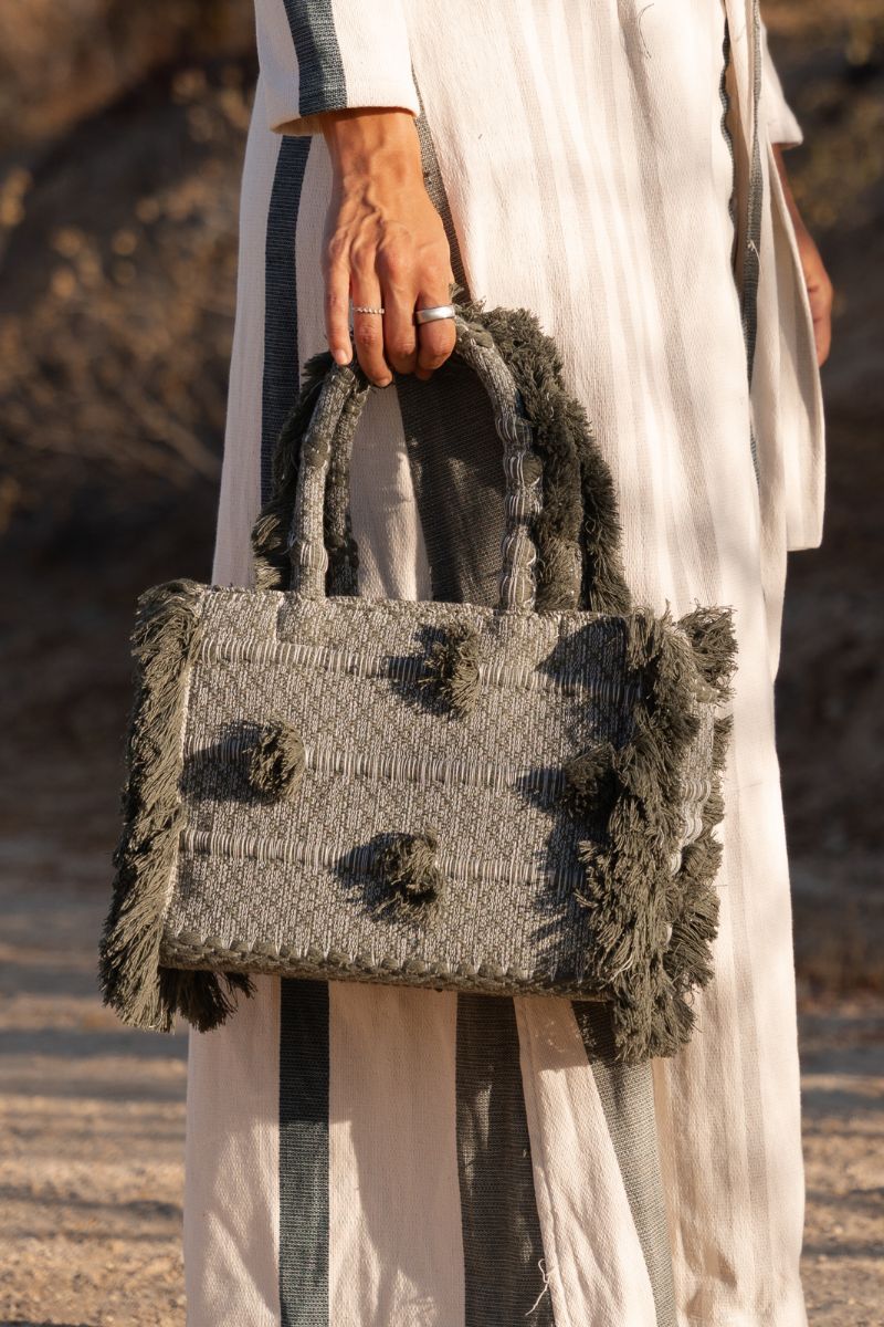 Bani medium olive top handle bag with structured design, featuring a sleek handle and minimalist style.