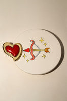 Liya Heartfelt red earrings featuring heart-shaped design, hanging dangle style, with gold-tone accents on a white background.