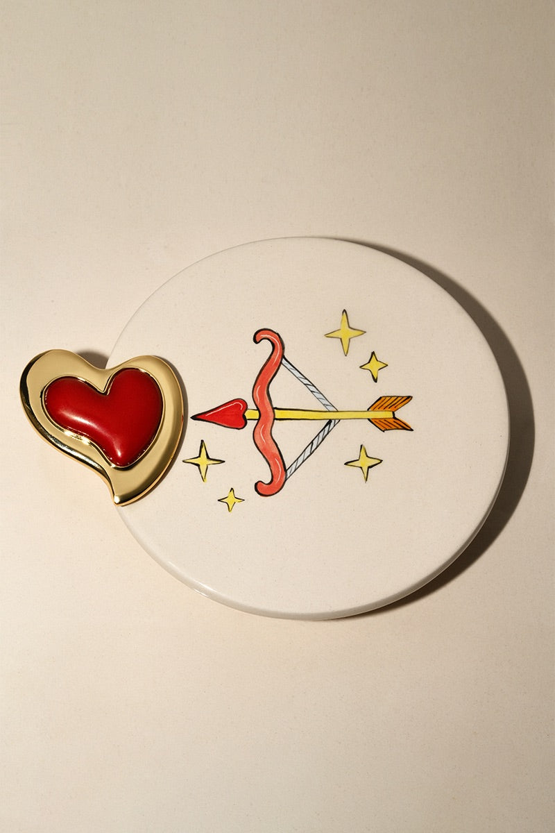 Liya Heartfelt red earrings featuring heart-shaped design, hanging dangle style, with gold-tone accents on a white background.