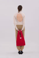 Cream long sleeve top by La Granni, fitted with a round neckline and soft fabric, displayed on a hanger.