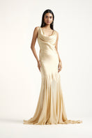 Deme By Gabriella Collen Gold gown featuring elegant fabric and a flowing silhouette, perfect for formal occasions.
