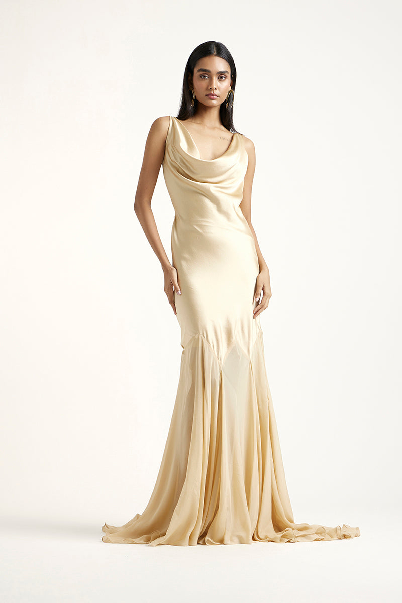 Deme By Gabriella Collen Gold gown featuring elegant fabric and a flowing silhouette, perfect for formal occasions.