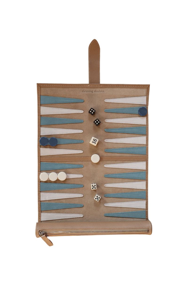 Travel Backgammon board in St. Barth by Throwing Doubles, featuring colorful game pieces and a stylish portable design.
