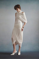 White Plan Lumière draped midi dress featuring flowing fabric and elegant design, displayed on a mannequin.