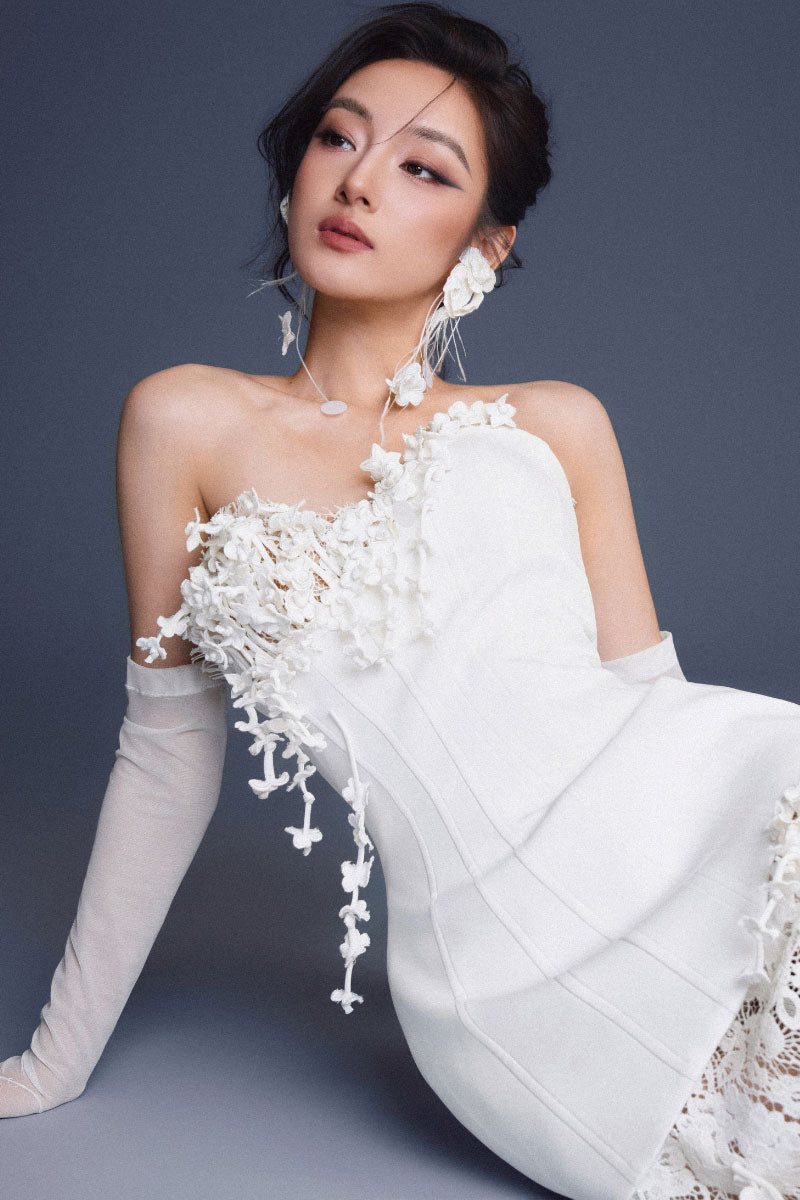 Keira Tong bouquet corset lace gown featuring intricate lace details and a fitted silhouette, ideal for elegant occasions.