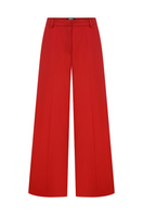 Sudi Etuz low waist straight cut pants in a neutral color, shown on a model with a focus on the fit and style.