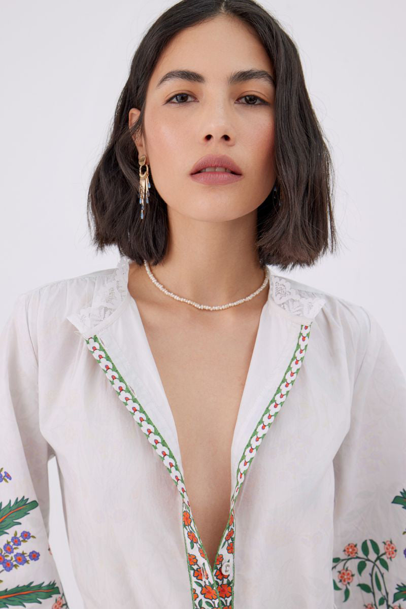 Raishma Angelina white maxi dress featuring elegant flowing fabric and a stylish, sleeveless design for special occasions.