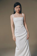 Keira Tong ripple maxi dress with flowing fabric and waist tie, stylish and comfortable for casual or dressy occasions.