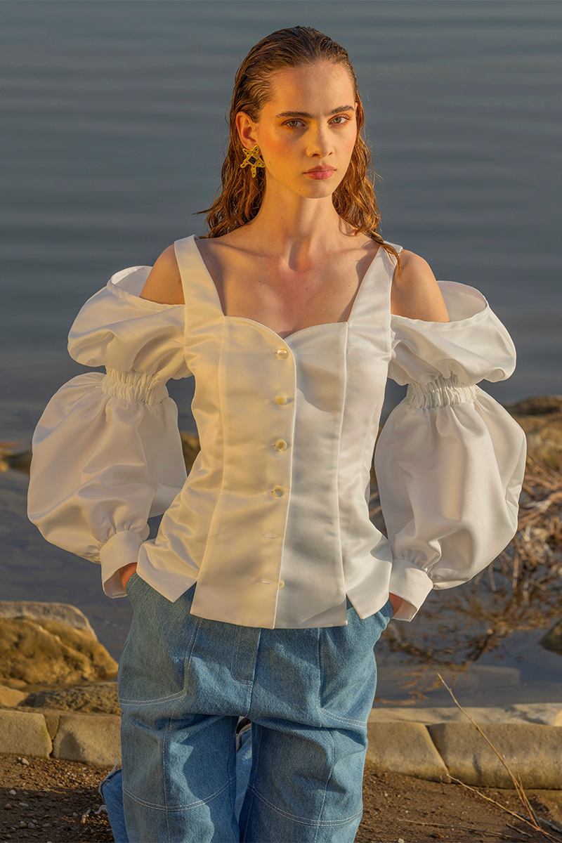 Liya Aqua Denim Relaxed Pants displayed flat, showing the light blue denim fabric, relaxed fit, and classic pant style.