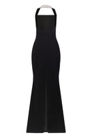 Black Lili Blanc refined power gown with elegant draping and long sleeves, displayed on a dress form.