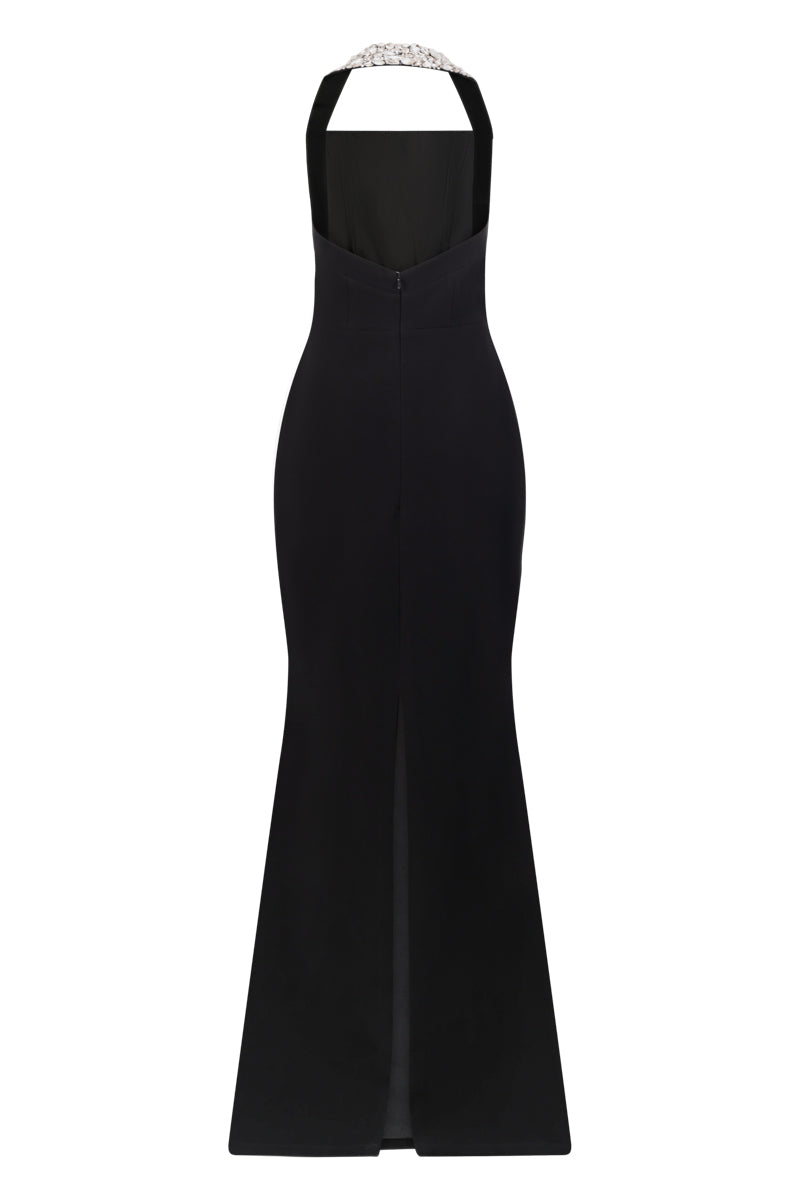 Black Lili Blanc refined power gown with elegant draping and long sleeves, displayed on a dress form.