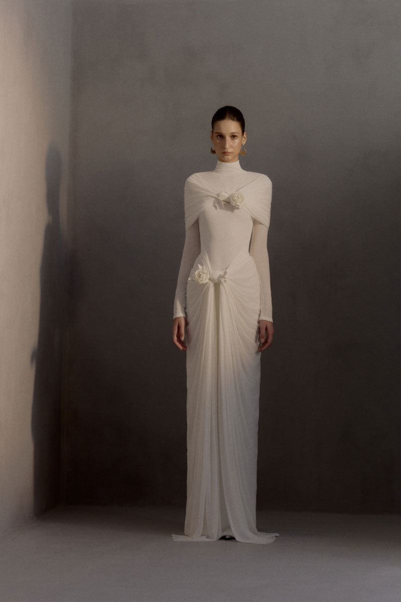White Plan Jacqueline gown featuring elegant fabric and a flowing silhouette, perfect for formal occasions.