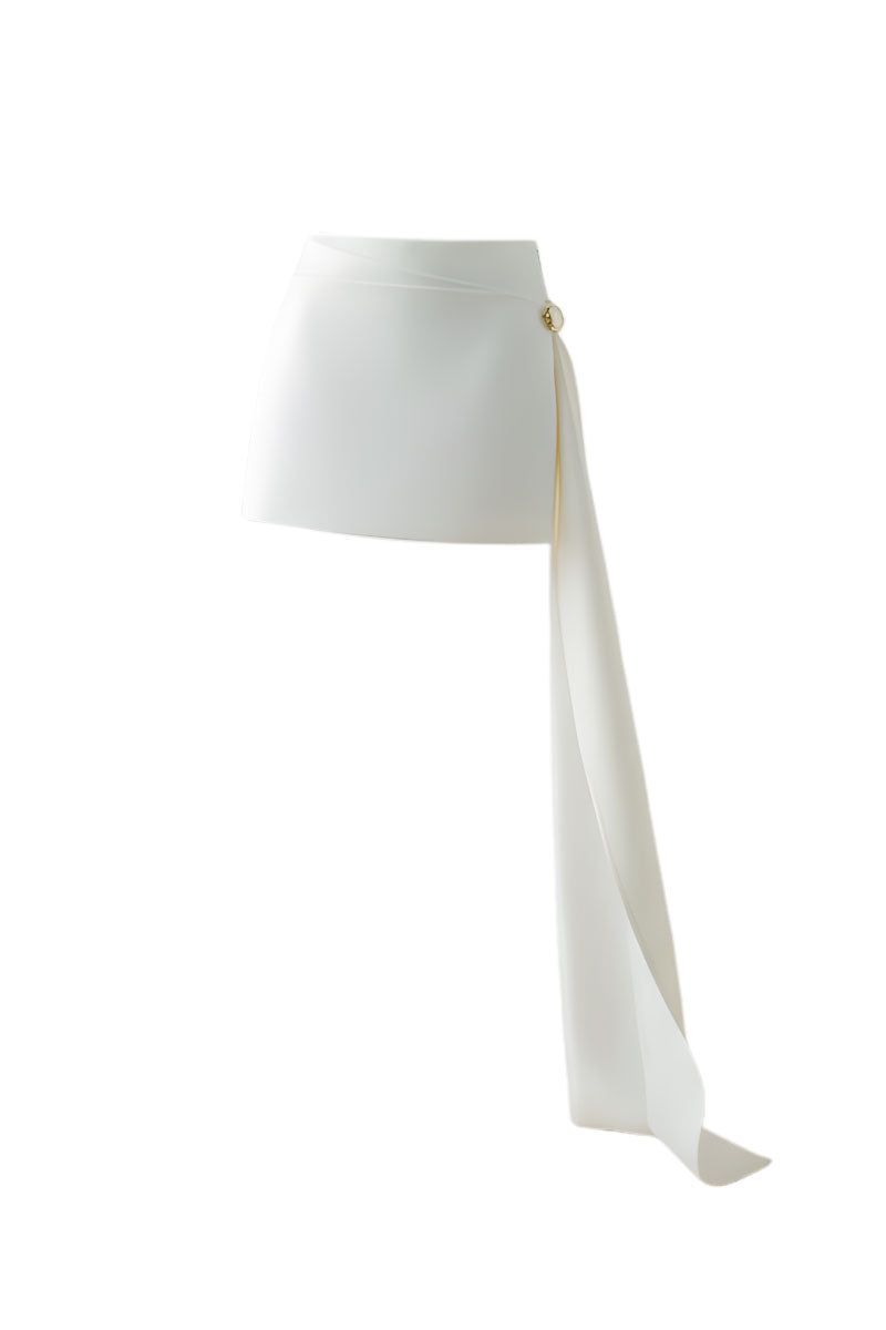 Black DOC BAN trailing mini skirt with a fitted waist and subtle side slit, styled with casual top and accessories.