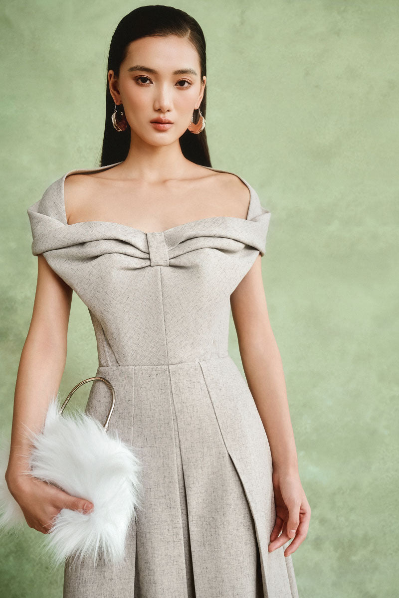 Gray off-shoulder pleated midi dress by White Plan, featuring a flowing design and elegant fit, shown on a model.
