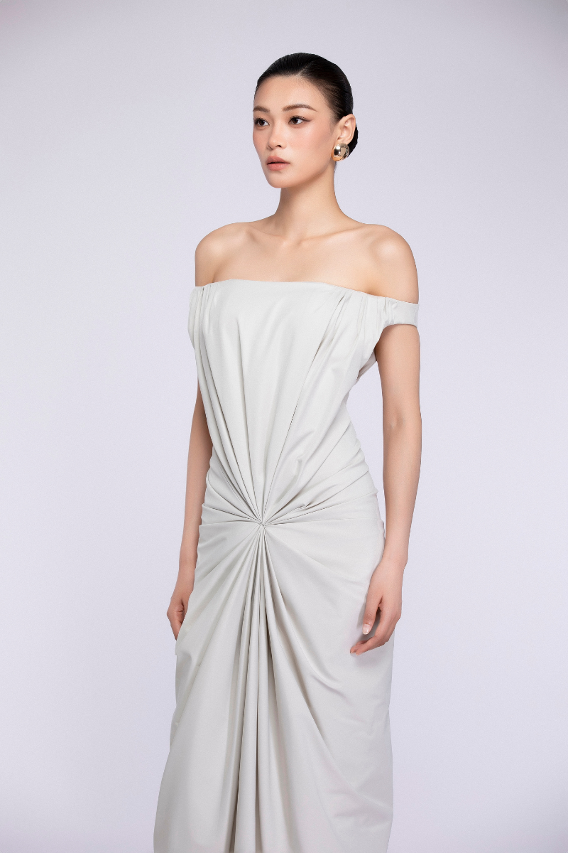 Ivory TONYY maxi dress with flowing fabric and sleeveless design, stylish for casual or formal occasions.