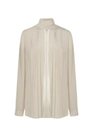 LEKIEU Dawlish Cream Silk Chiffon Shirt displayed on a hanger, showcasing lightweight, flowy fabric and elegant design.