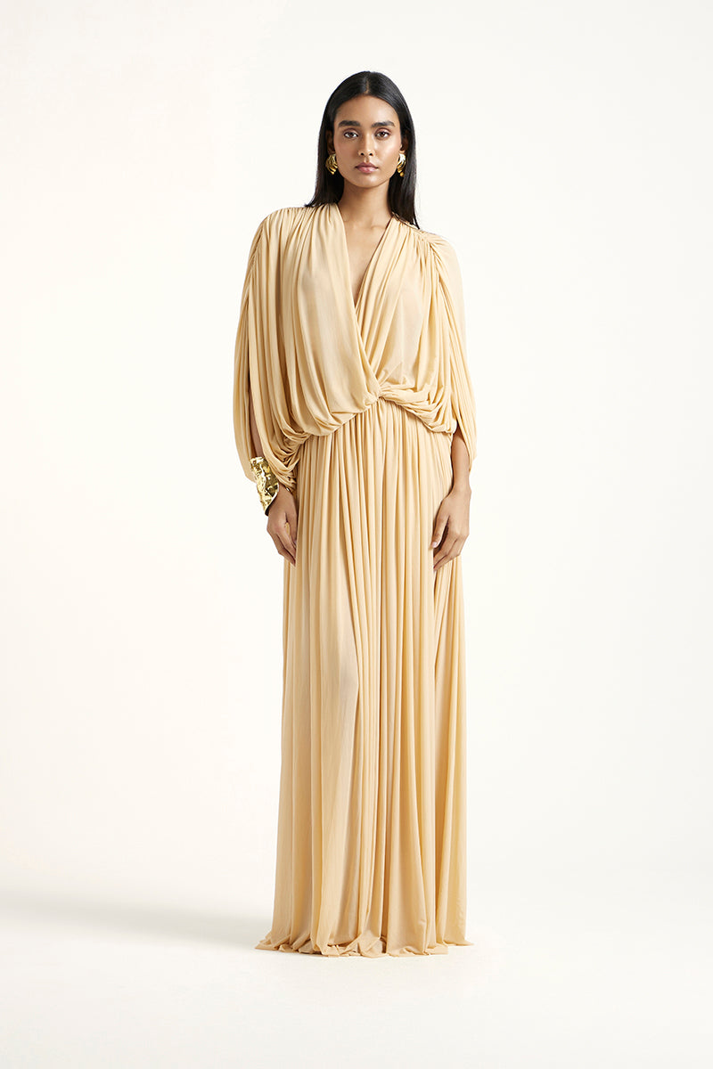 Deme By Gabriella gold RORI maxi dress with flowing fabric and elegant design, perfect for formal occasions.