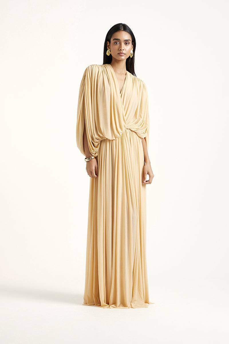 Deme By Gabriella RORI gold maxi dress featuring flowing fabric and elegant design, perfect for formal occasions.