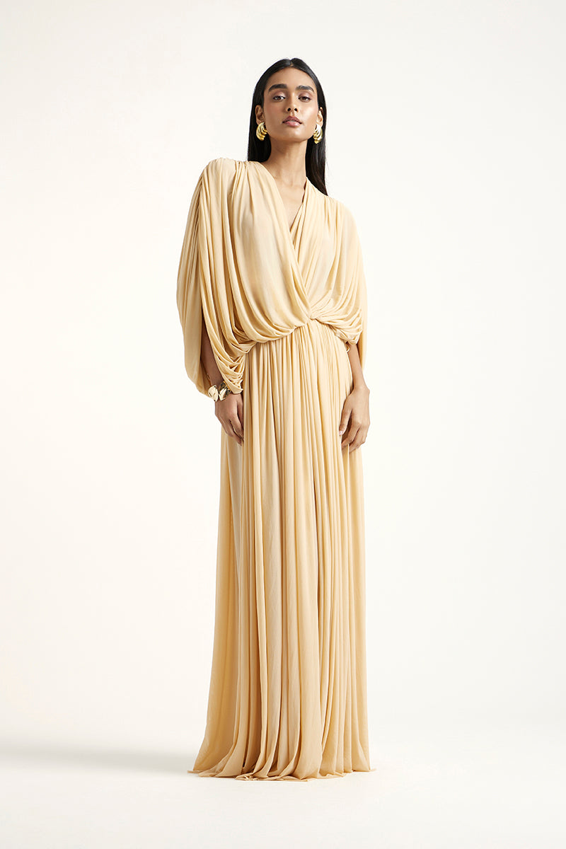 Deme By Gabriella RORI gold maxi dress with flowing fabric, elegant design, and stylish silhouette, perfect for formal occasions.