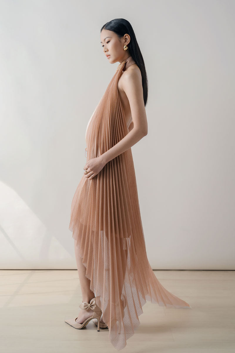 Peach pleated halter neck chiffon midi dress by DOC BAN, flowing fabric with elegant pleats and a stylish halter neckline.