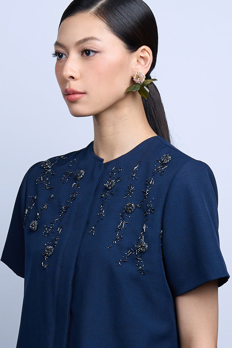 Green DEW DOT earrings by Aidan & Ice featuring round, vibrant earrings with a sleek, modern design.