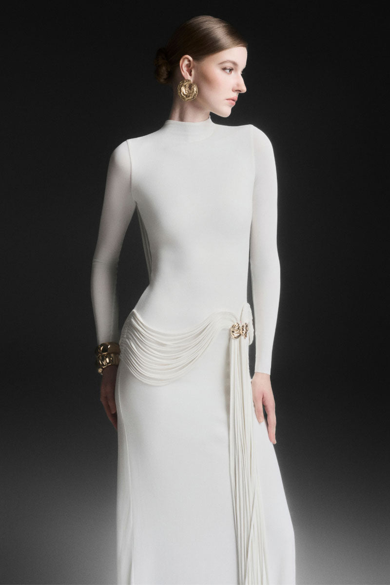 White Maison Des Copains Corvina draped floor-length maxi dress displayed on a model.