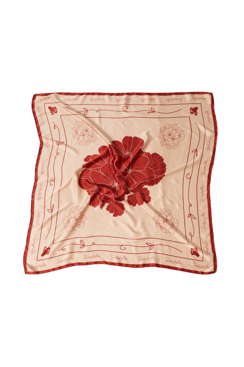 Señorita Luisa scarf in vibrant red, soft fabric with elegant drape, perfect for adding a stylish touch to any outfit.