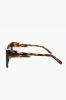 Dark crocodile-patterned Moy Atelier sunglasses with sleek black frames and tinted lenses, stylish and modern accessory.