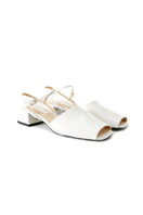 Chictopia ivory peep toe slingback heels sandals with open toe and strap detail on a stylish model.