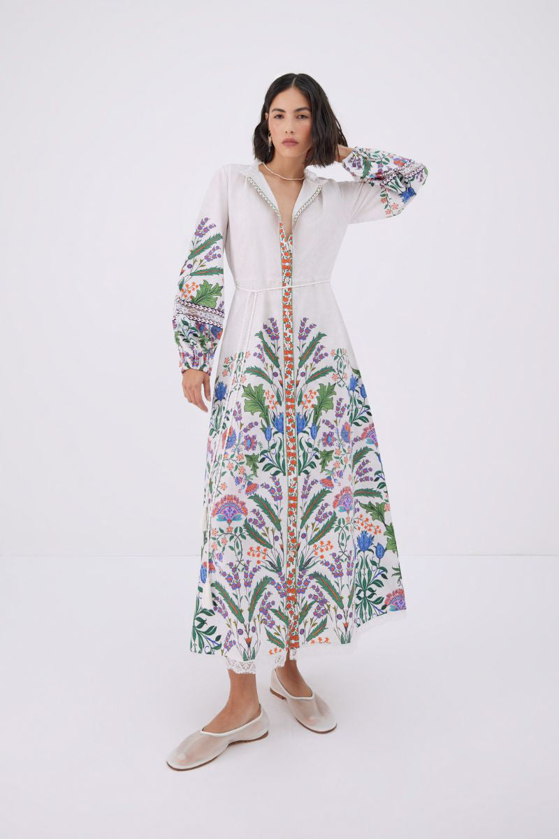 Raishma Angelina white maxi dress displayed on a hanger, flowing fabric, elegant design, perfect for formal or summer occasions.