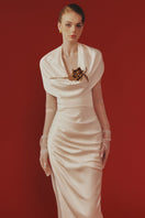 Elegant Celina gown by Margée Atelier featuring flowing fabric and intricate detailing, perfect for formal occasions.