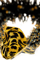 SAC DE SOUL leopard print black and gold shoulder bag with gold chain strap and bold print design.