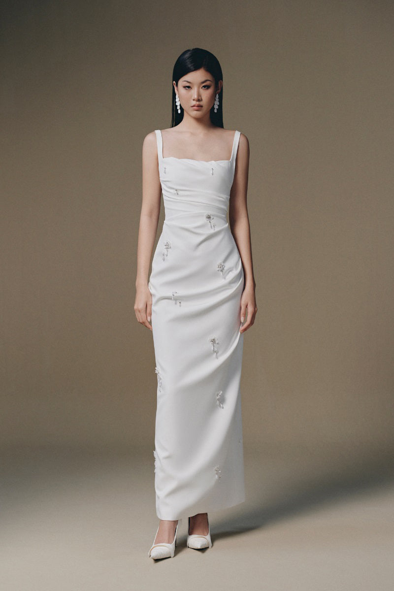 Keira Tong Ripple Dress maxi dress with flowing fabric and elegant design, displayed on a hanger.