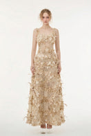 Beige Alessia silk taffeta and tulle gown by 21Six featuring elegant flowing fabric and intricate design.