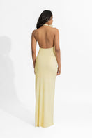 Deme By Gabriella Adela Butter Yellow Maxi Dress displayed on a hanger, featuring flowing fabric and elegant design.