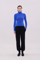 Blue long sleeve top from La Granni, featuring a comfortable fit and simple design, shown on a white background.